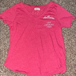 A hot pink Hollister Tee Shirt.